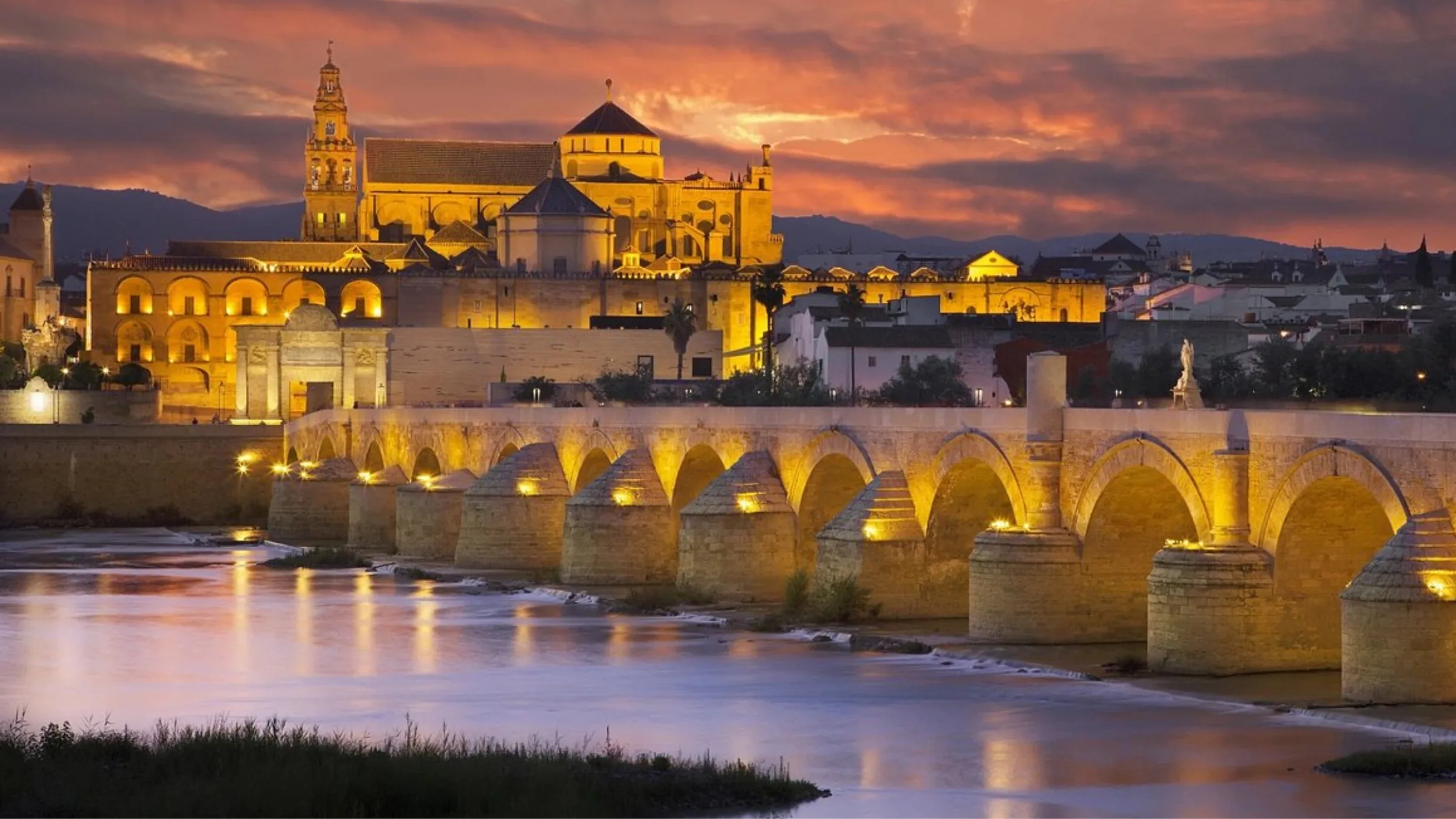 Roman Bridge and Mezquita-Cathedral of Córdoba at dusk